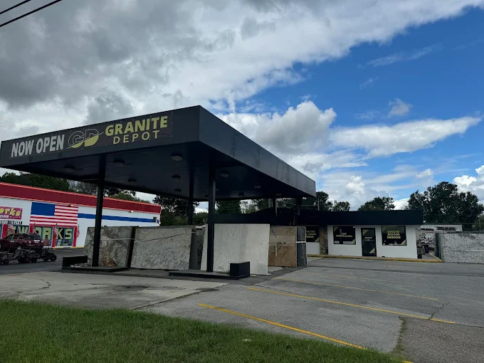 Granite Depot Sevierville showroom canopy with Now Open signage